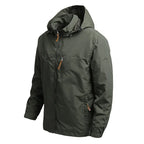 VALEWARD Vanguard Tactical Jacket in Ranger Green, three-quarter view showing the storm hood and chest pocket.
